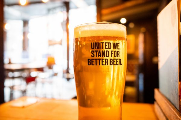 Newcastle UK - Oct 2021 - Pint of craft beer in a Brewdog bar, no logos. United We Stand for Better Beer