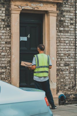 An Amazon delivery driver brings a package to a door. Amazon has taken the online shopping market by storm past COVID-19. With low prices and fast delivery times, Amazon has opened Pandora's box for store-less shopping. 